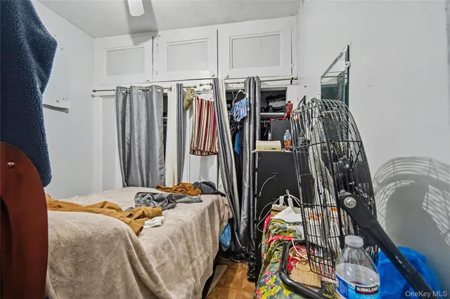 a view of walk in closet with clothes