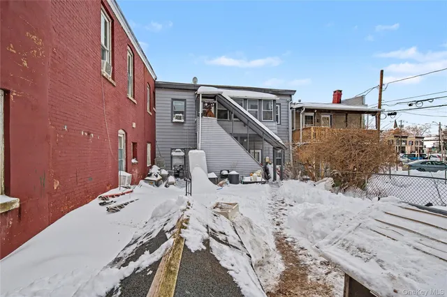 a view of a balcony with chairs