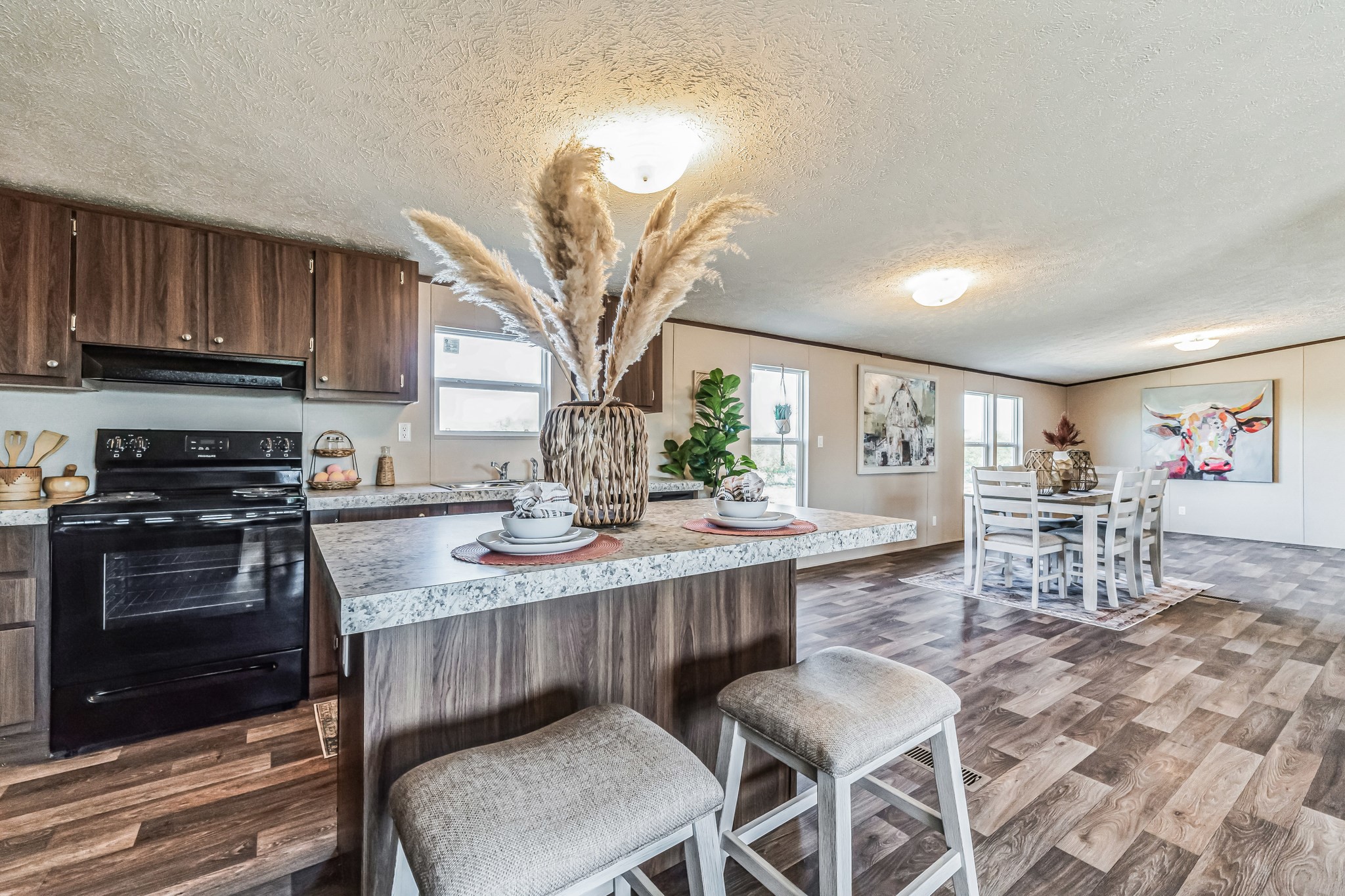 260 Pr Frio Estates Moore, TX 78057 - Photo 2 of 33 a kitchen with stainless steel appliances granite countertop a sink a stove a dining table and chairs