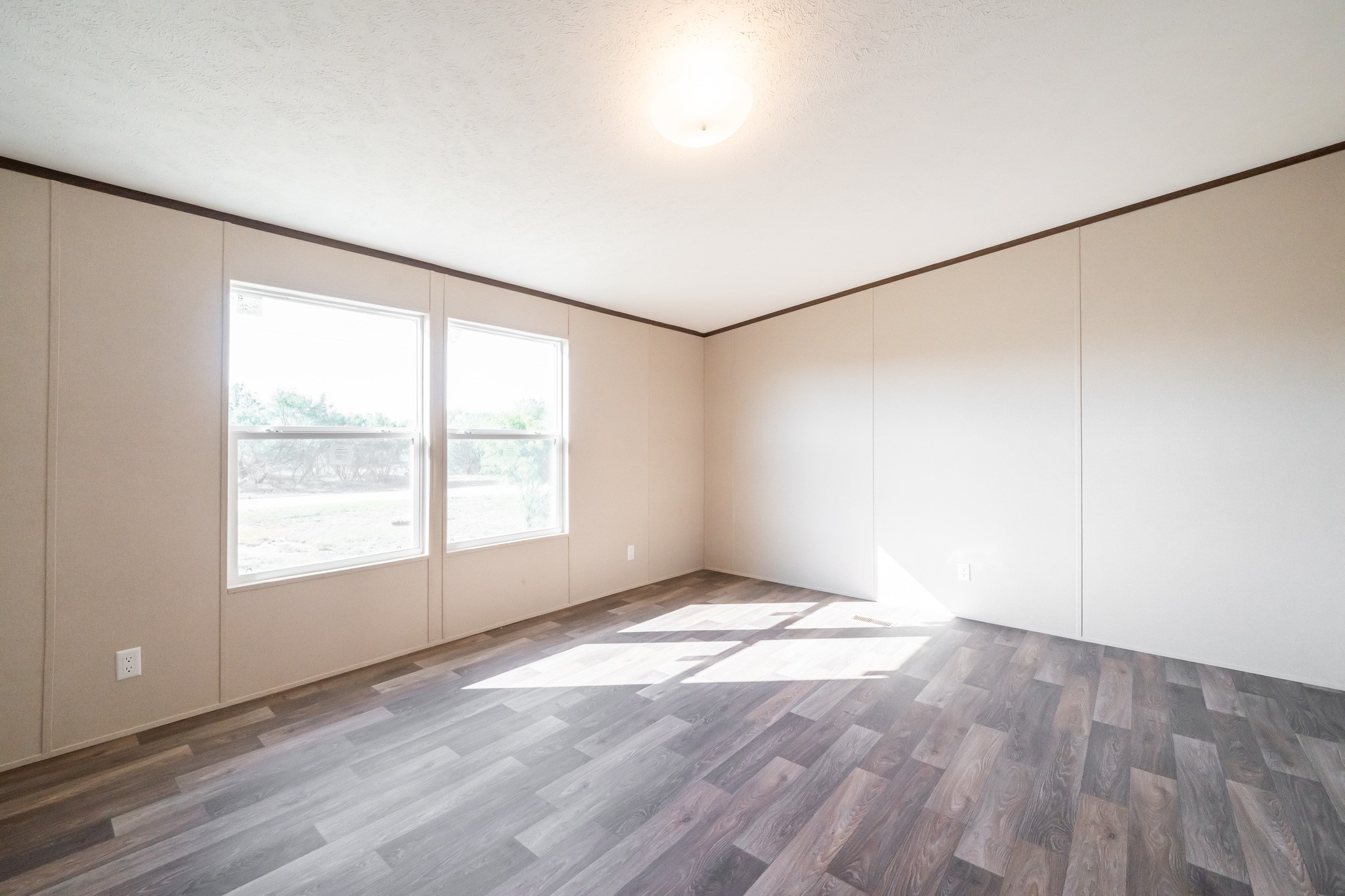 260 Pr Frio Estates Moore, TX 78057 - Photo 24 of 33 an empty room with wooden floor and windows