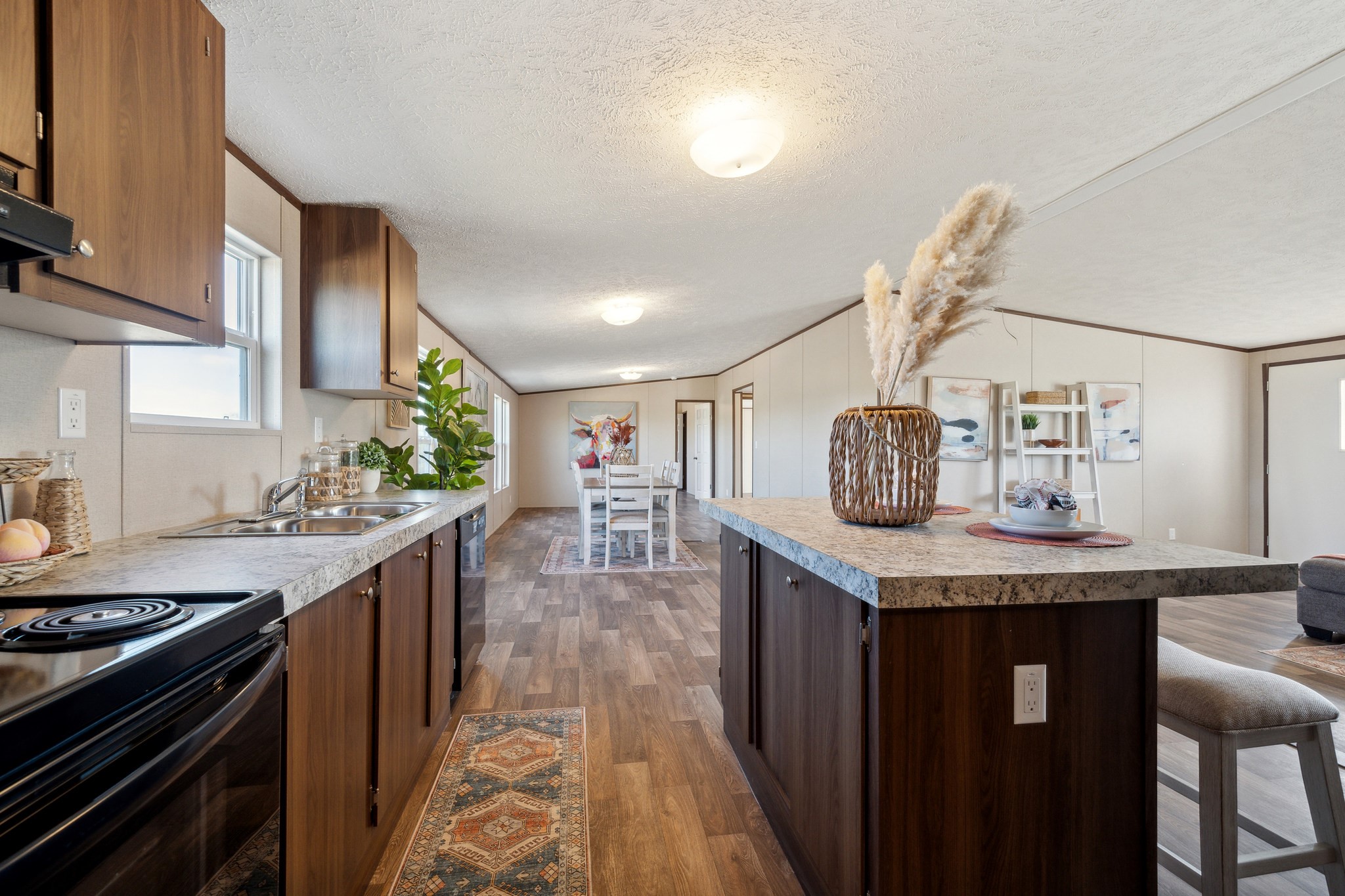 260 Pr Frio Estates Moore, TX 78057 - Photo 5 of 33 a kitchen with stainless steel appliances granite countertop a stove a sink dishwasher and cabinets with wooden floor