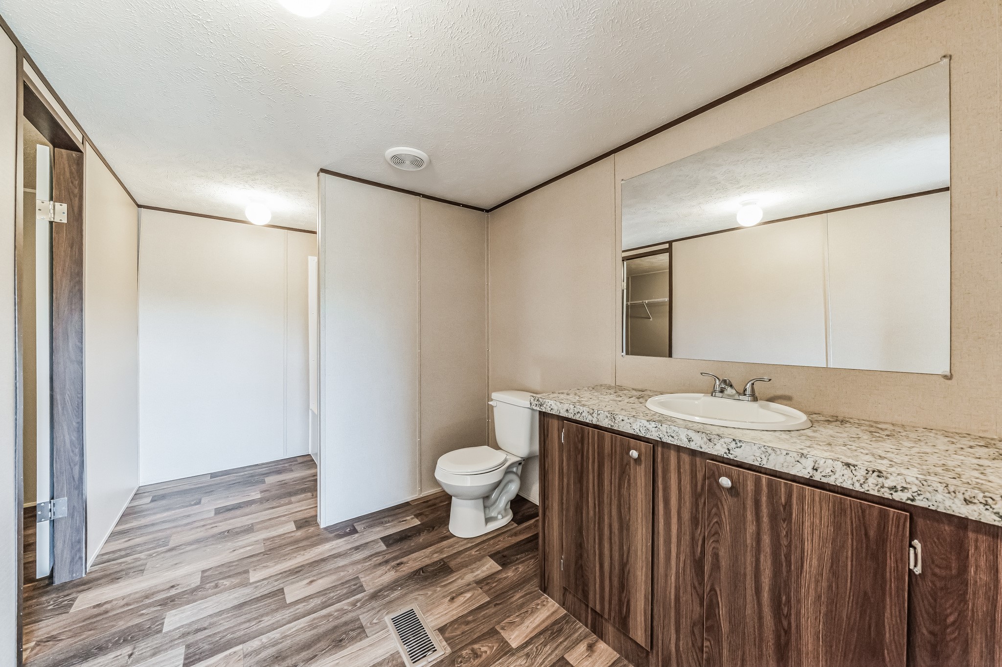 260 Pr Frio Estates Moore, TX 78057 - Photo 10 of 33 a bathroom with a granite countertop sink toilet and shower