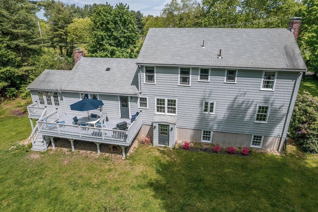 16 Main Street Boxford, MA 01921 - Photo 29 of 34 a aerial view of a house with table and chairs