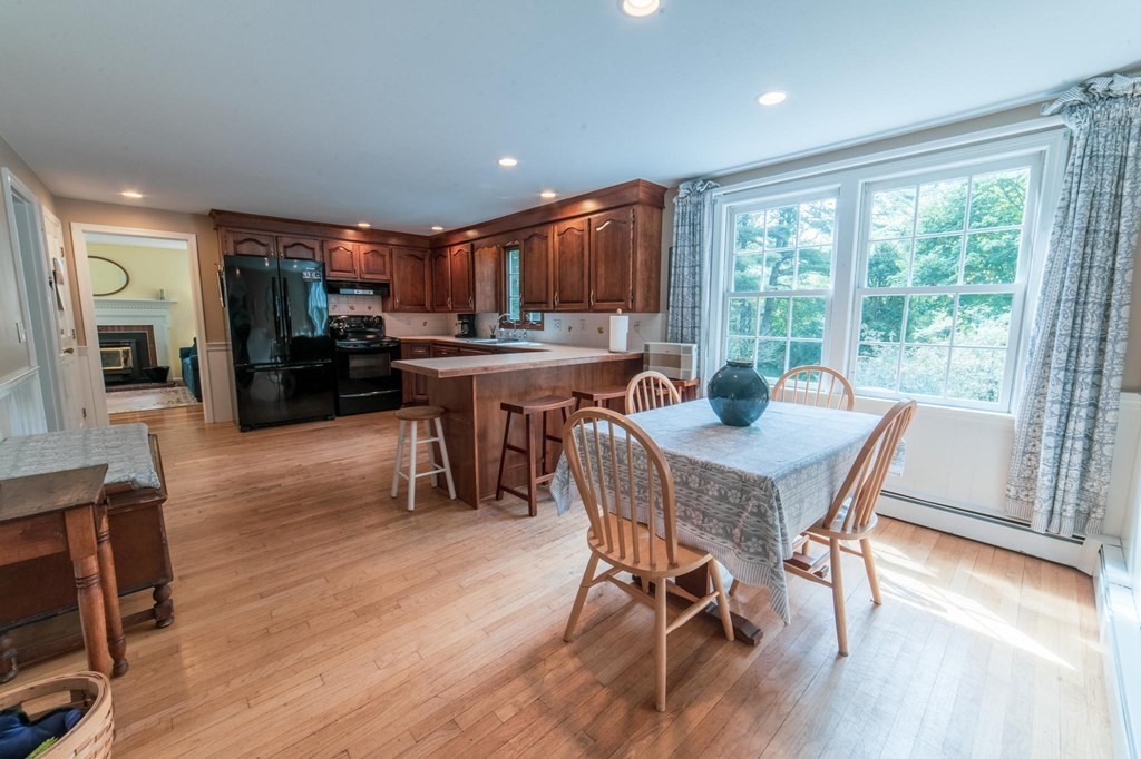 16 Main Street Boxford, MA 01921 - Photo 6 of 34 a view of a dining room with furniture window and wooden floor