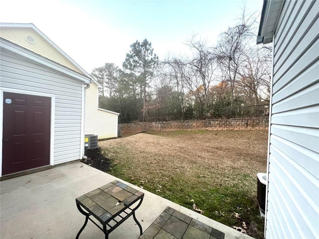 3854 Austin Park Lane Decatur, GA 30032 - Photo 15 of 44 a view of a backyard with a chair and table