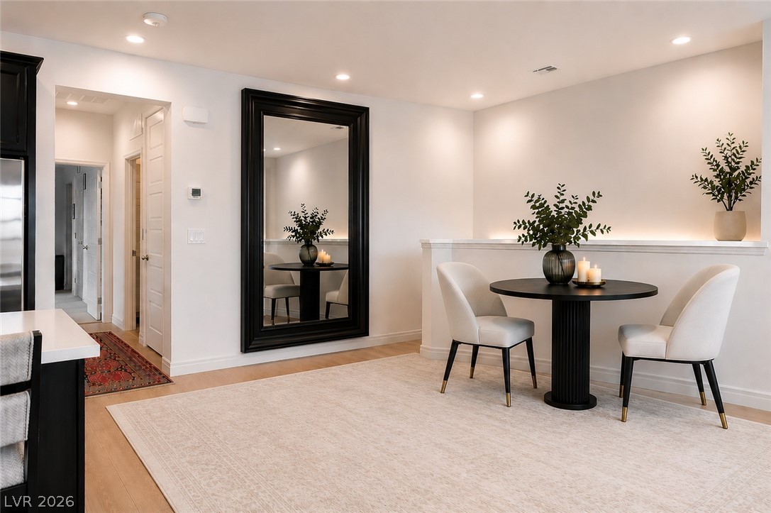 7330 North Decatur Boulevard, Unit 6 North Las Vegas, NV 89084 - Photo 8 of 42 Recessed lighting illuminates this inviting dining area, perfect for intimate gatherings.
