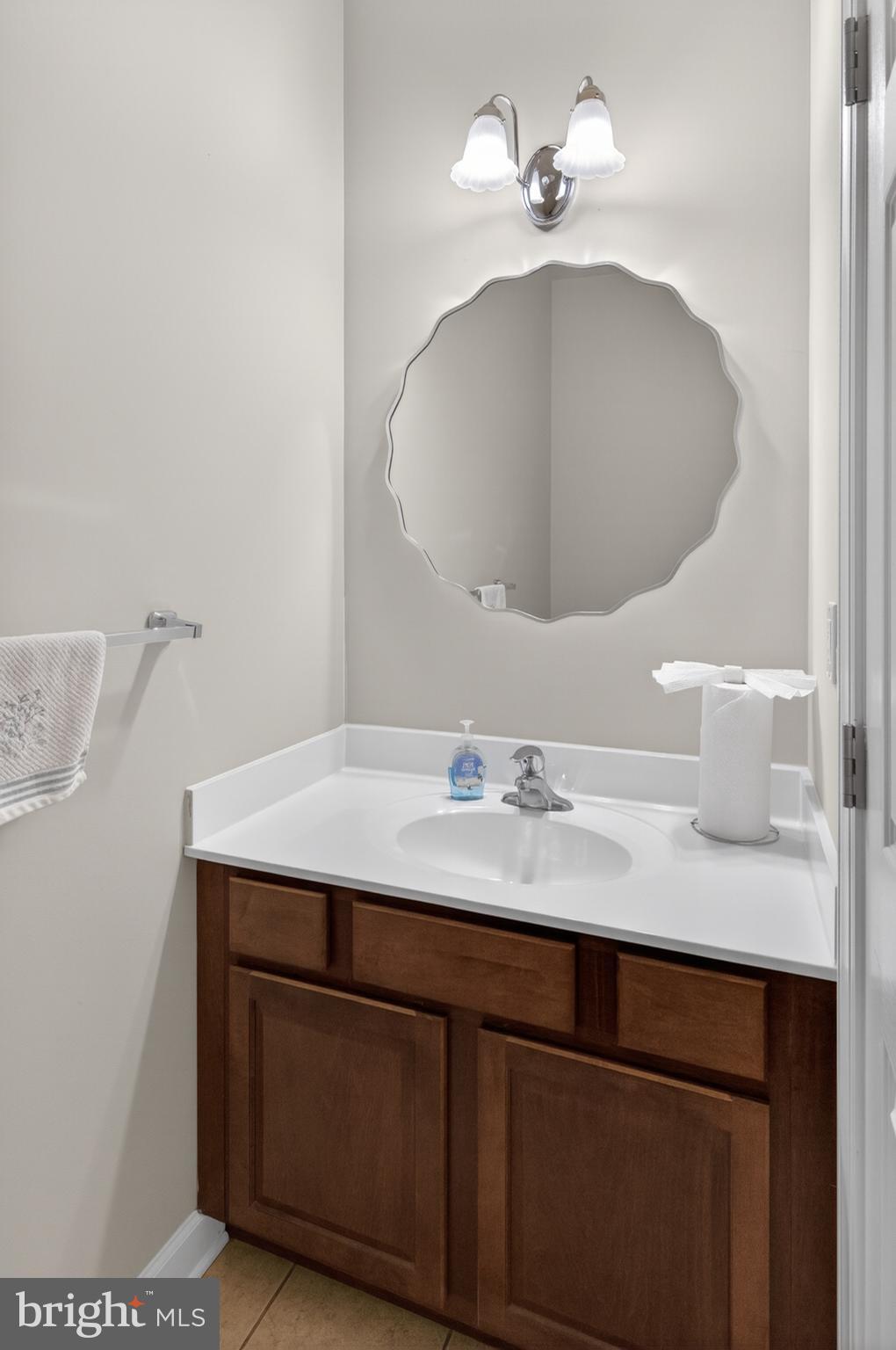 337 Roe Ingleside Road Centreville, MD 21617 - Photo 38 of 56 a bathroom with a sink granite and a mirror