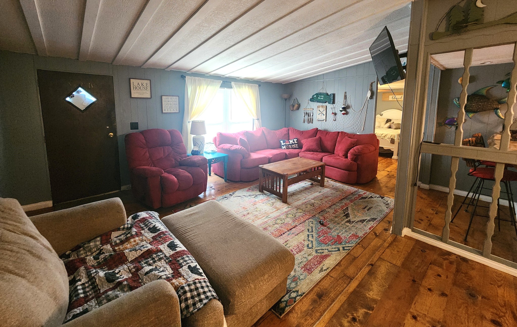 45 Walker Road Springville, TN 38256 - Photo 4 of 20 a living room with furniture a lamp wooden floor and a rug