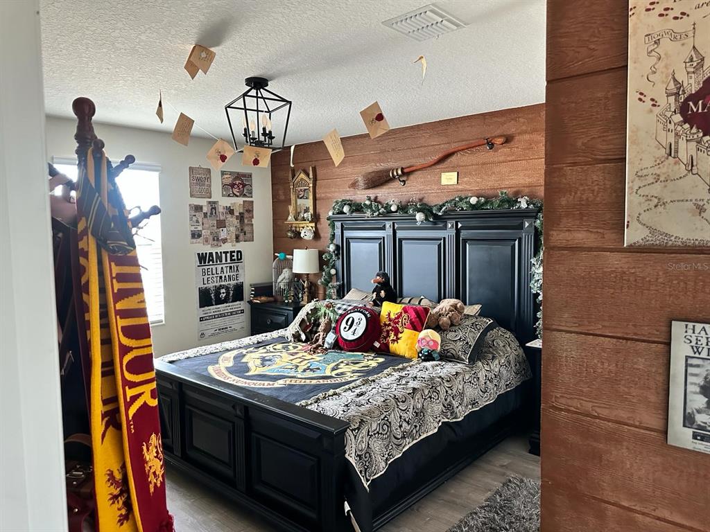 4499 Magnolia Ridge Court Kissimmee, FL 34746 - Photo 12 of 43 a living room with furniture a rug and a window