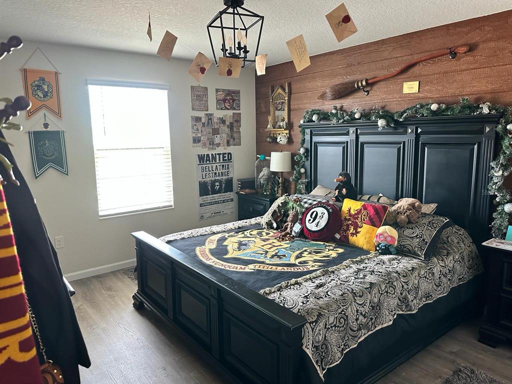 4499 Magnolia Ridge Court Kissimmee, FL 34746 - Photo 13 of 43 a living room with furniture and flat screen tv