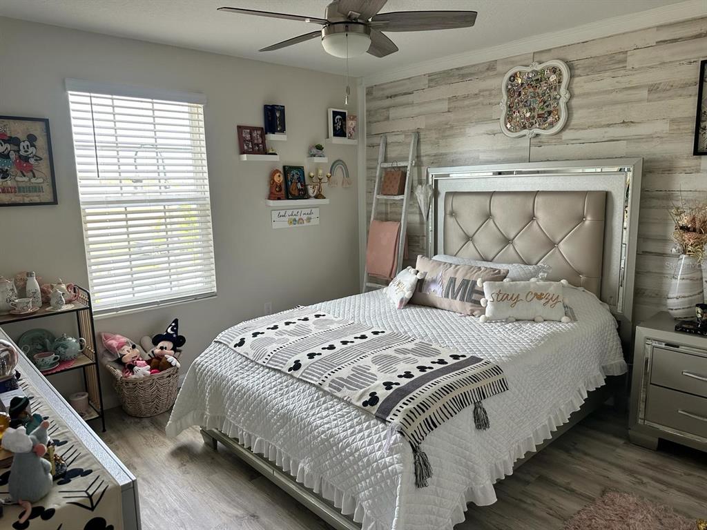 4499 Magnolia Ridge Court Kissimmee, FL 34746 - Photo 17 of 43 a bedroom with a bed and window