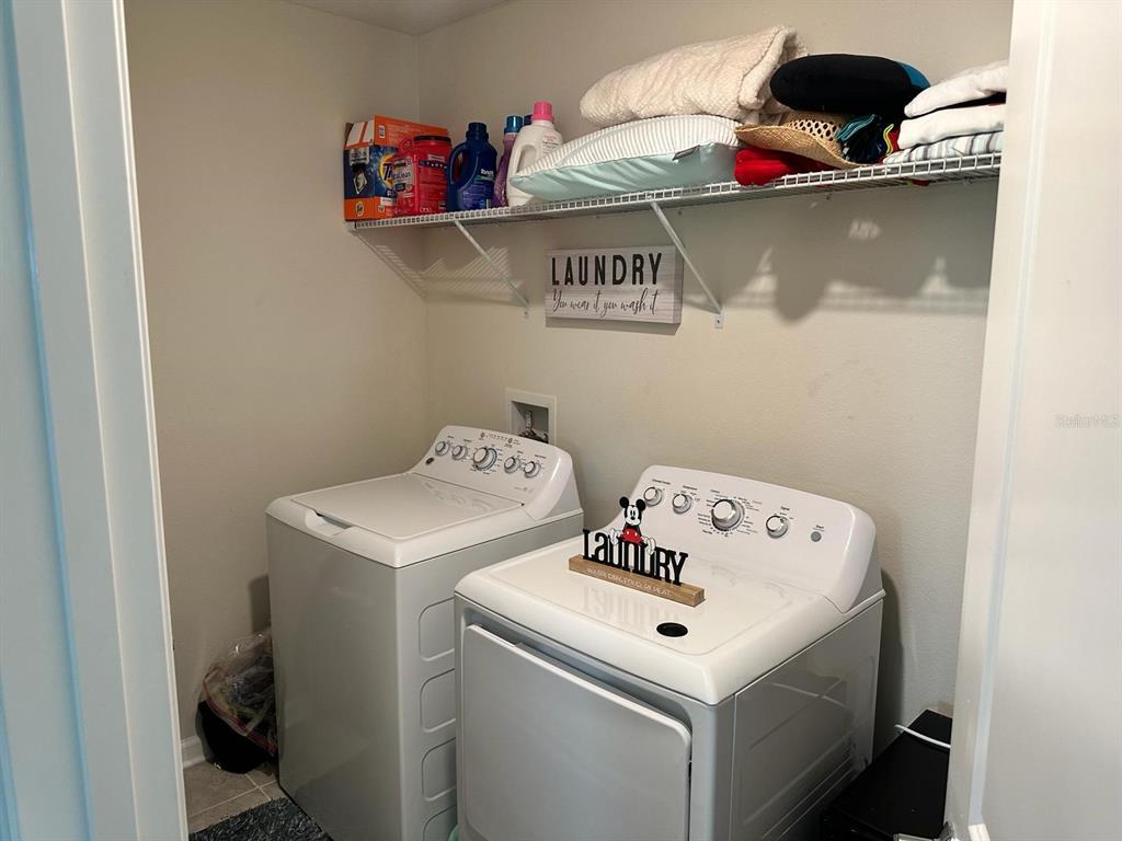 4499 Magnolia Ridge Court Kissimmee, FL 34746 - Photo 27 of 43 a utility room with dryer and washer