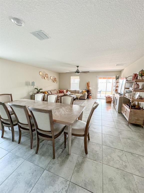 4499 Magnolia Ridge Court Kissimmee, FL 34746 - Photo 28 of 43 a view of a dining room with furniture