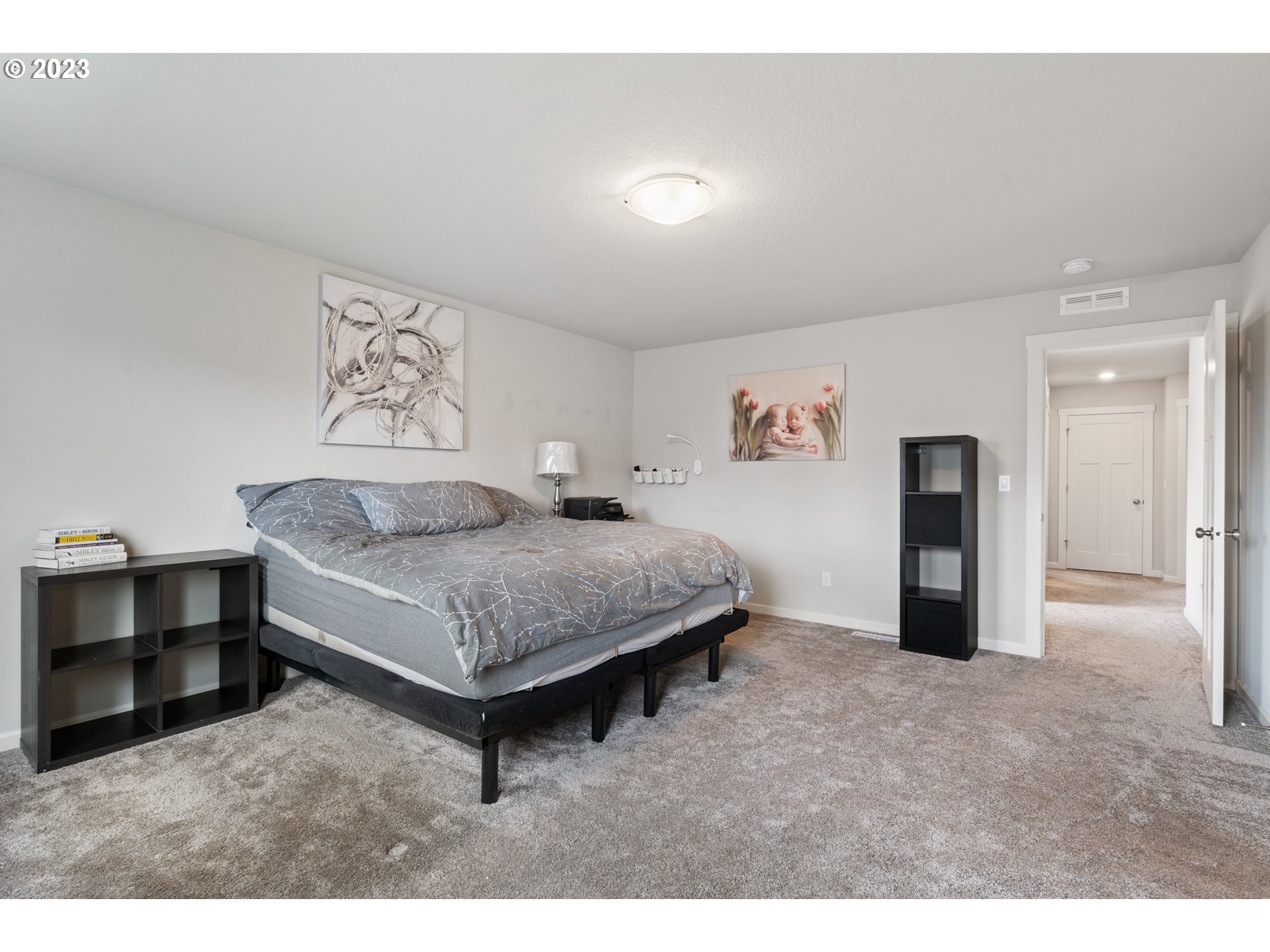 3912 South 41st Place Ridgefield, WA 98642 - Photo 8 of 20 a spacious bedroom with a bed and cabinet