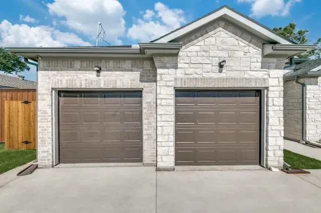 a front view of a house with a garage