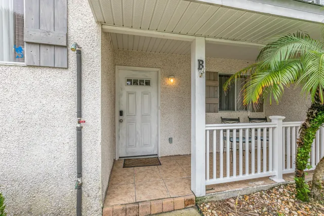 a view of a hallway with seating area