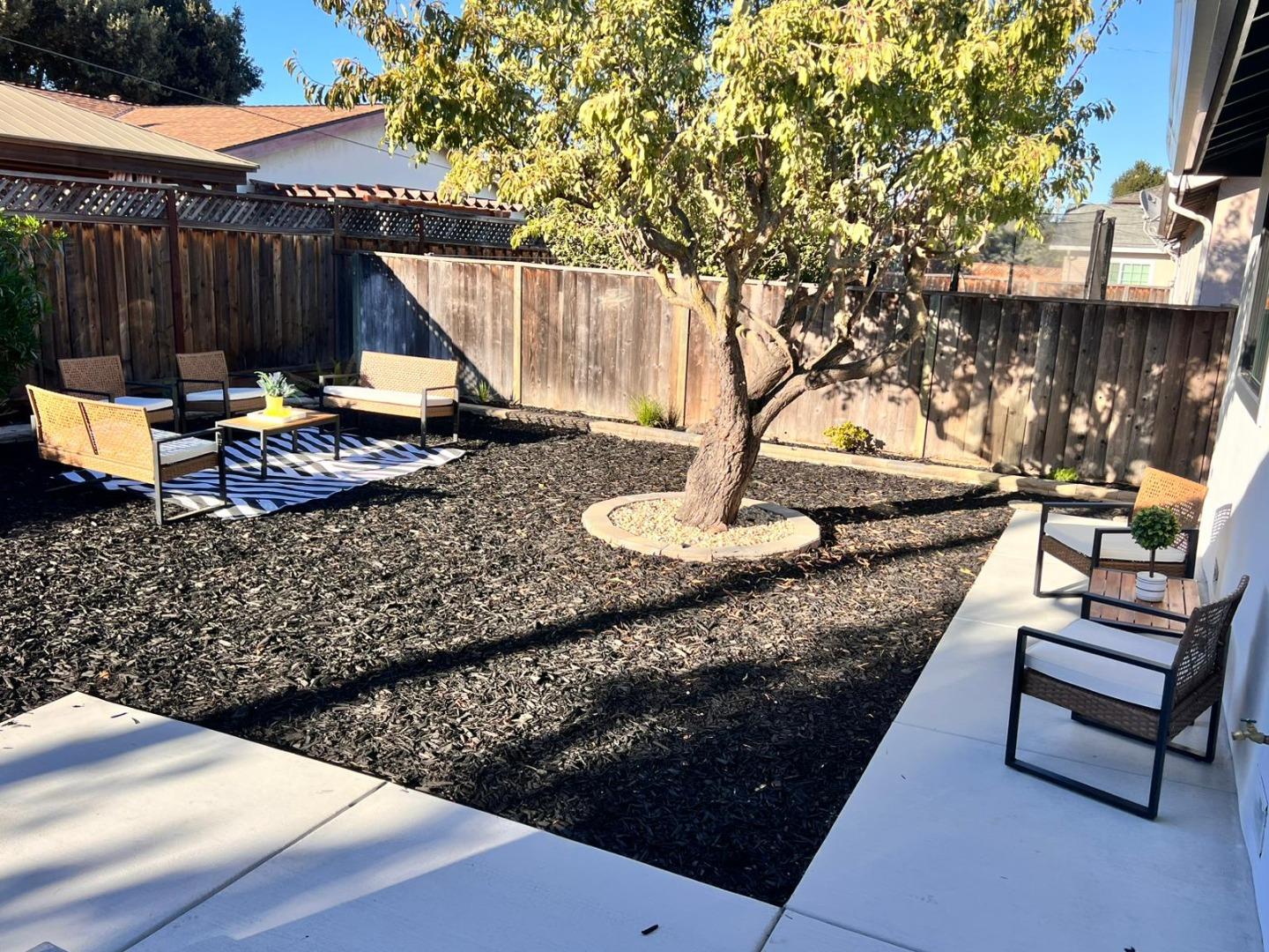 2038 Hoover Drive Santa Clara, CA 95051 - Photo 17 of 17 a view of a backyard with table and chairs