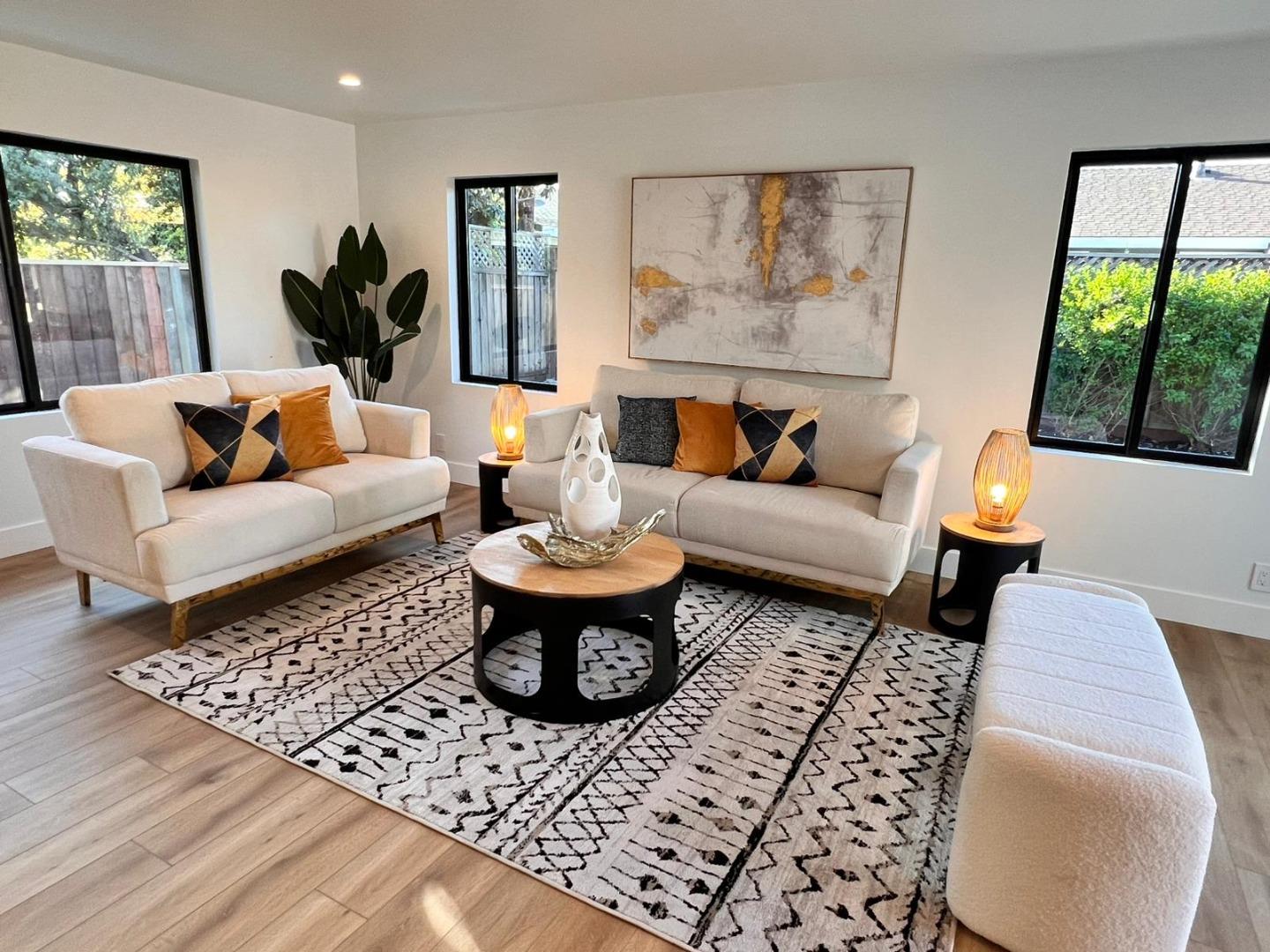 2038 Hoover Drive Santa Clara, CA 95051 - Photo 2 of 17 a living room with furniture a rug and a large window
