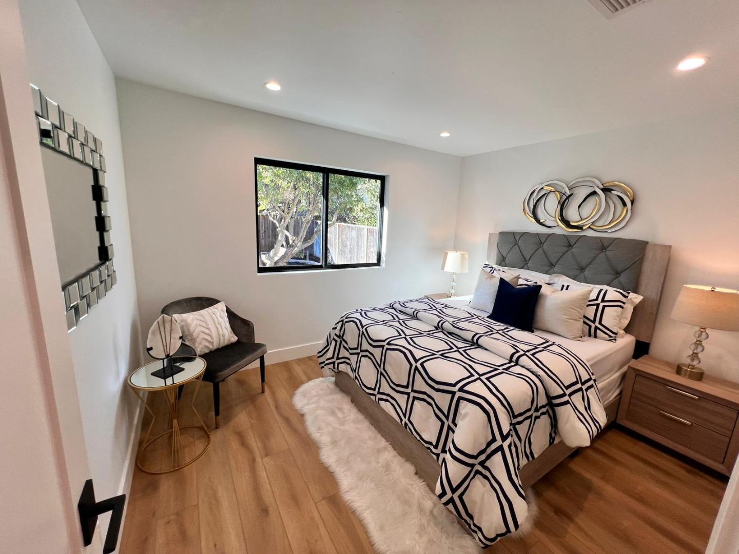 2038 Hoover Drive Santa Clara, CA 95051 - Photo 5 of 17 a bedroom with bed and wooden floor