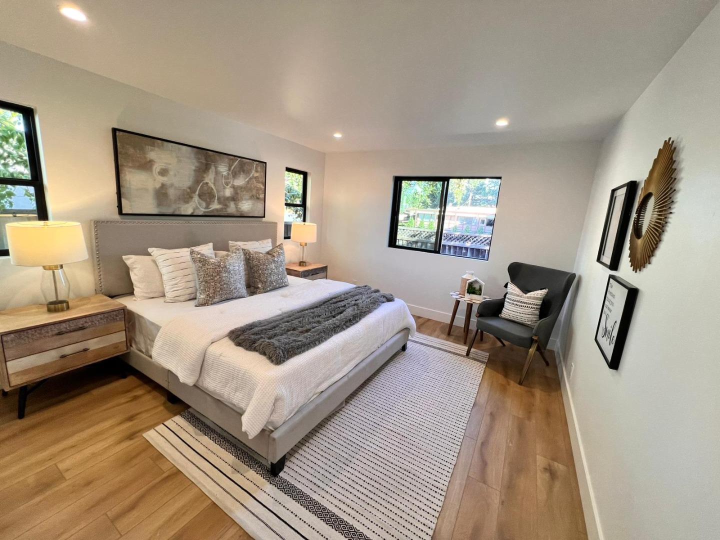 2038 Hoover Drive Santa Clara, CA 95051 - Photo 8 of 17 a bedroom with a bed and wooden floor