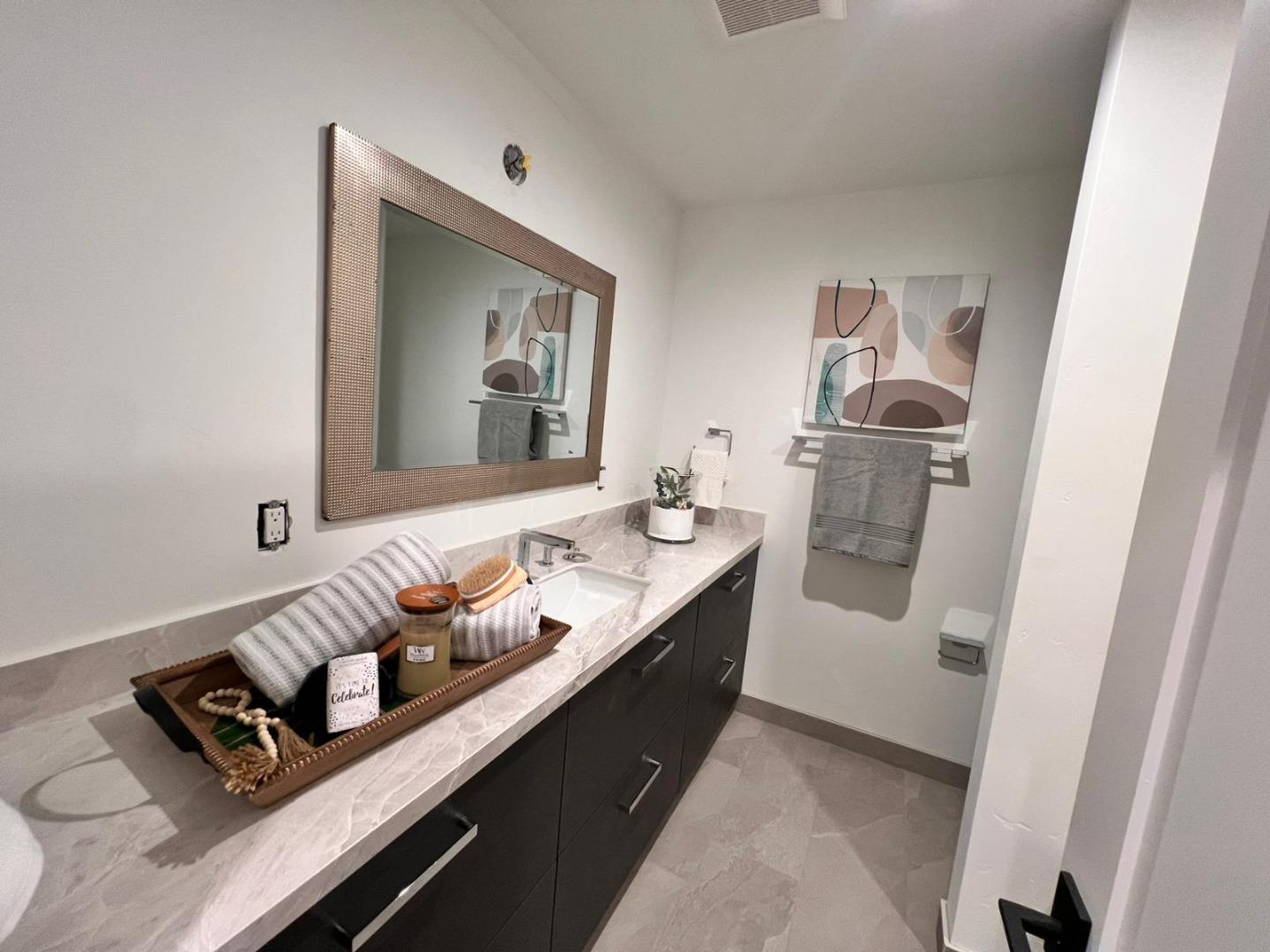 2038 Hoover Drive Santa Clara, CA 95051 - Photo 9 of 17 a bathroom with a double vanity sink and mirror