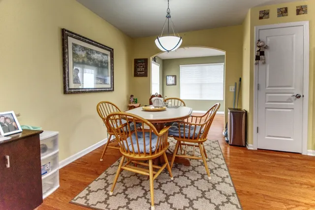 a dining room with furniture and window