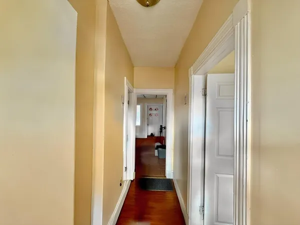 a bathroom with a tub toilet sink and mirror