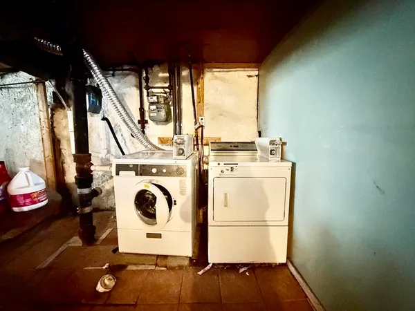 a front view of a residential apartment building with a yard