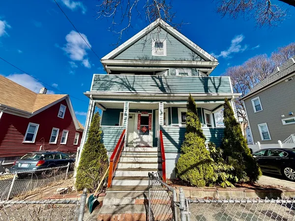 a car parked in front of a house