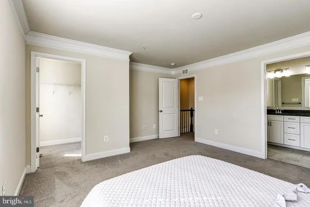 a bedroom with a bed and a television