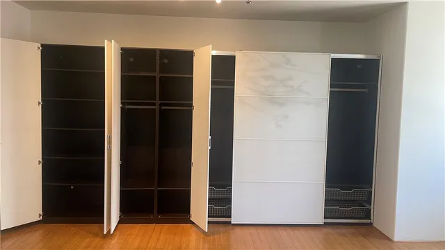 a view of walk in closet with an empty space