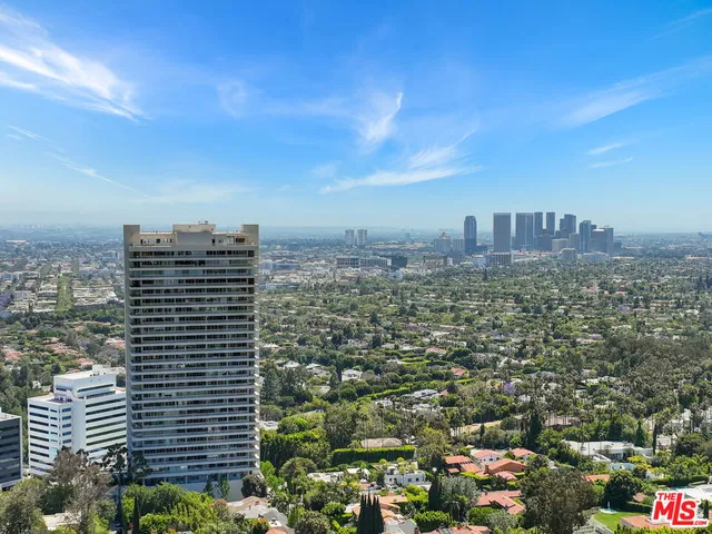 a view of backyard with outdoor seating and green space