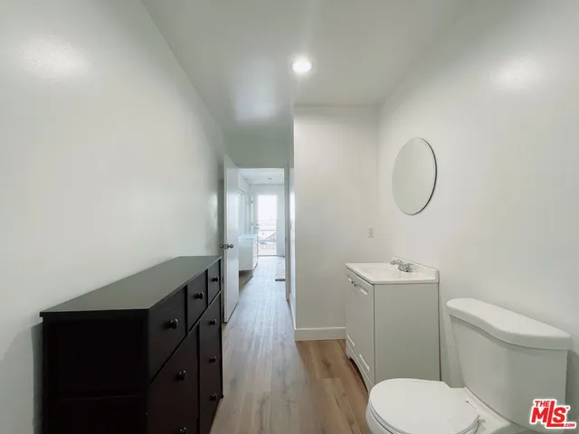 a bathroom with a toilet a sink and shower