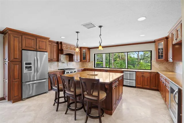 a bedroom with a large bed and a balcony view