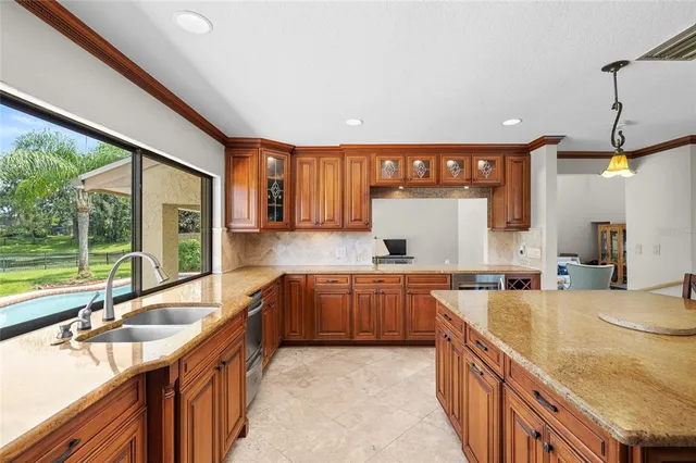 a bathroom with a granite countertop sink mirror and toilet