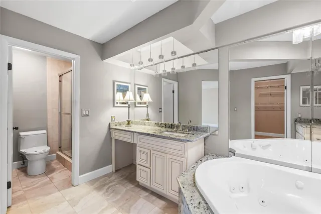 a bathroom with a shower and a toilet