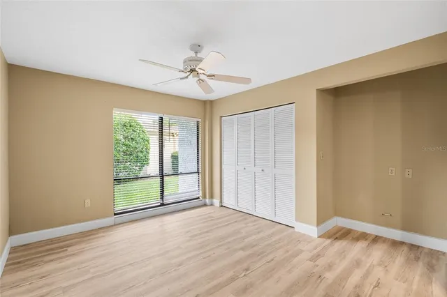 a view of a swimming pool and trees in the background