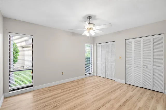 a view of a house with swimming pool and sitting area