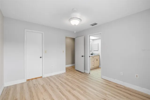 a backyard of a house with a yard and outdoor seating