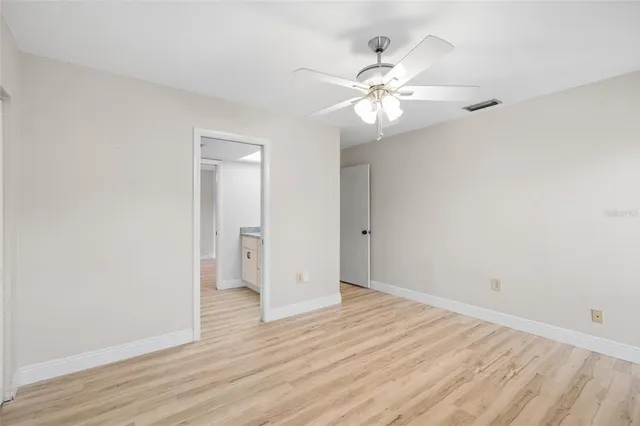 a view of yard with swimming pool and green space