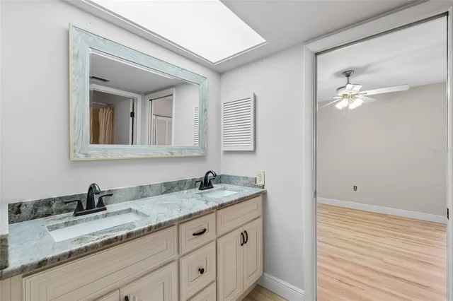 a front view of a house with a garden and yard