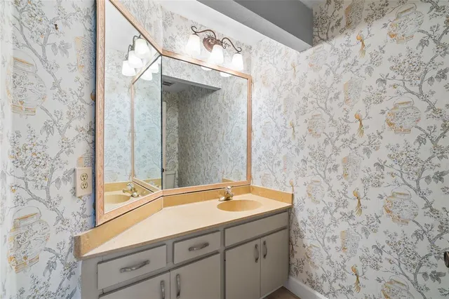 an aerial view of a house with outdoor space and lake view