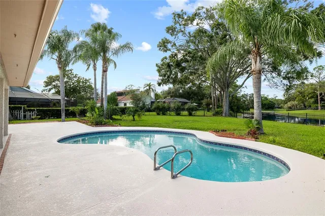 a view of a swimming pool with a lake view