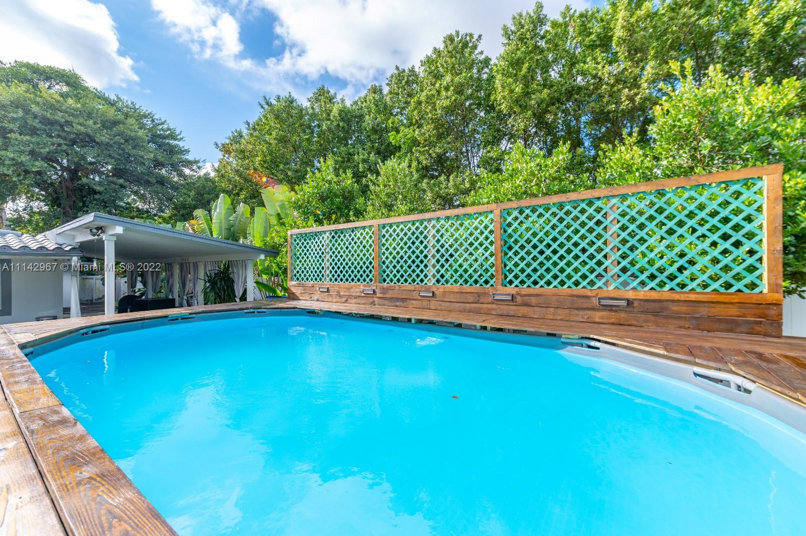 50 Southwest 21st Road Miami, FL 33129 - Photo 3 of 12 a view of a deck with a trees