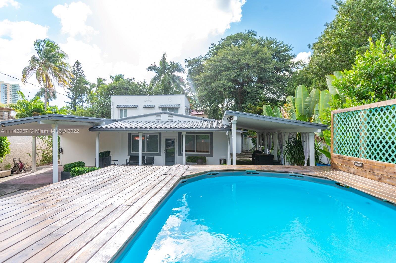 50 Southwest 21st Road Miami, FL 33129 - Photo 6 of 12 a view of a house with pool and sitting area