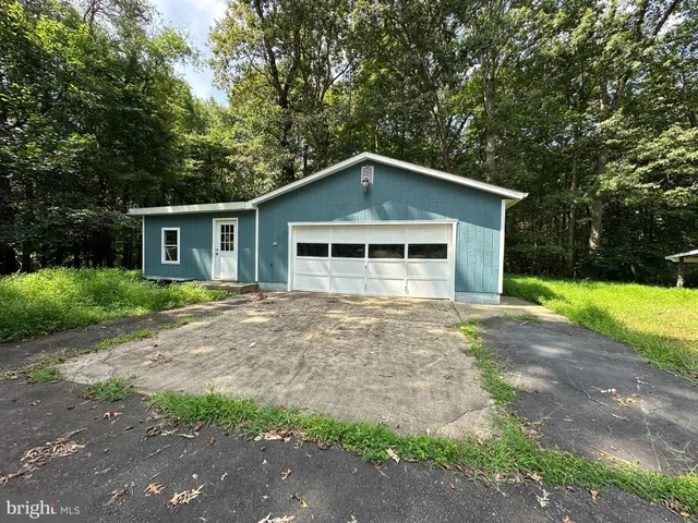 a front view of a house with yard