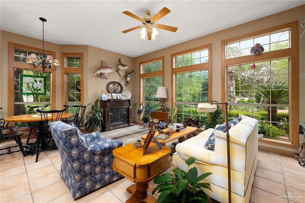 27603 Palo Verde Road San Benito, TX 78586 - Photo 12 of 45 a living room with patio furniture and a large window