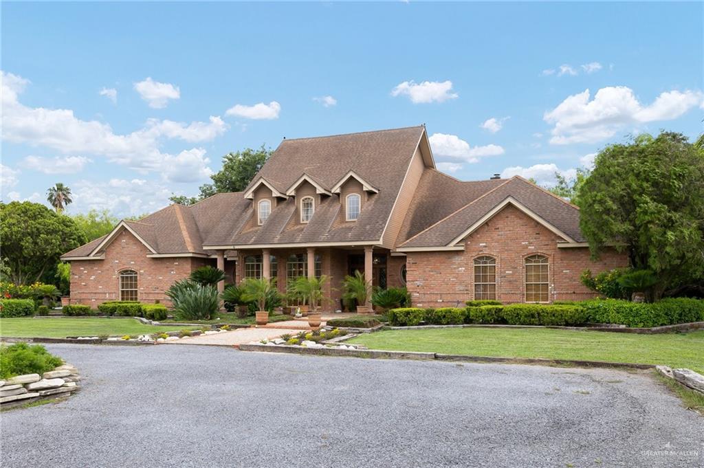 27603 Palo Verde Road San Benito, TX 78586 - Photo 3 of 45 a front view of house with yard and green space
