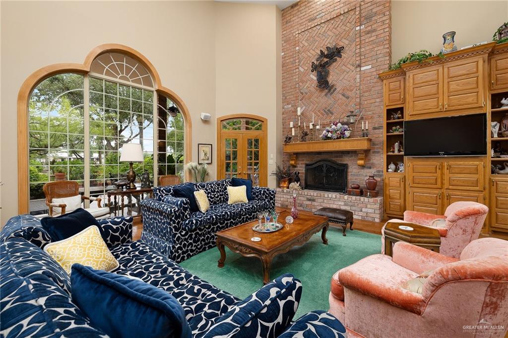 27603 Palo Verde Road San Benito, TX 78586 - Photo 8 of 45 a living room with furniture fireplace and a flat screen tv