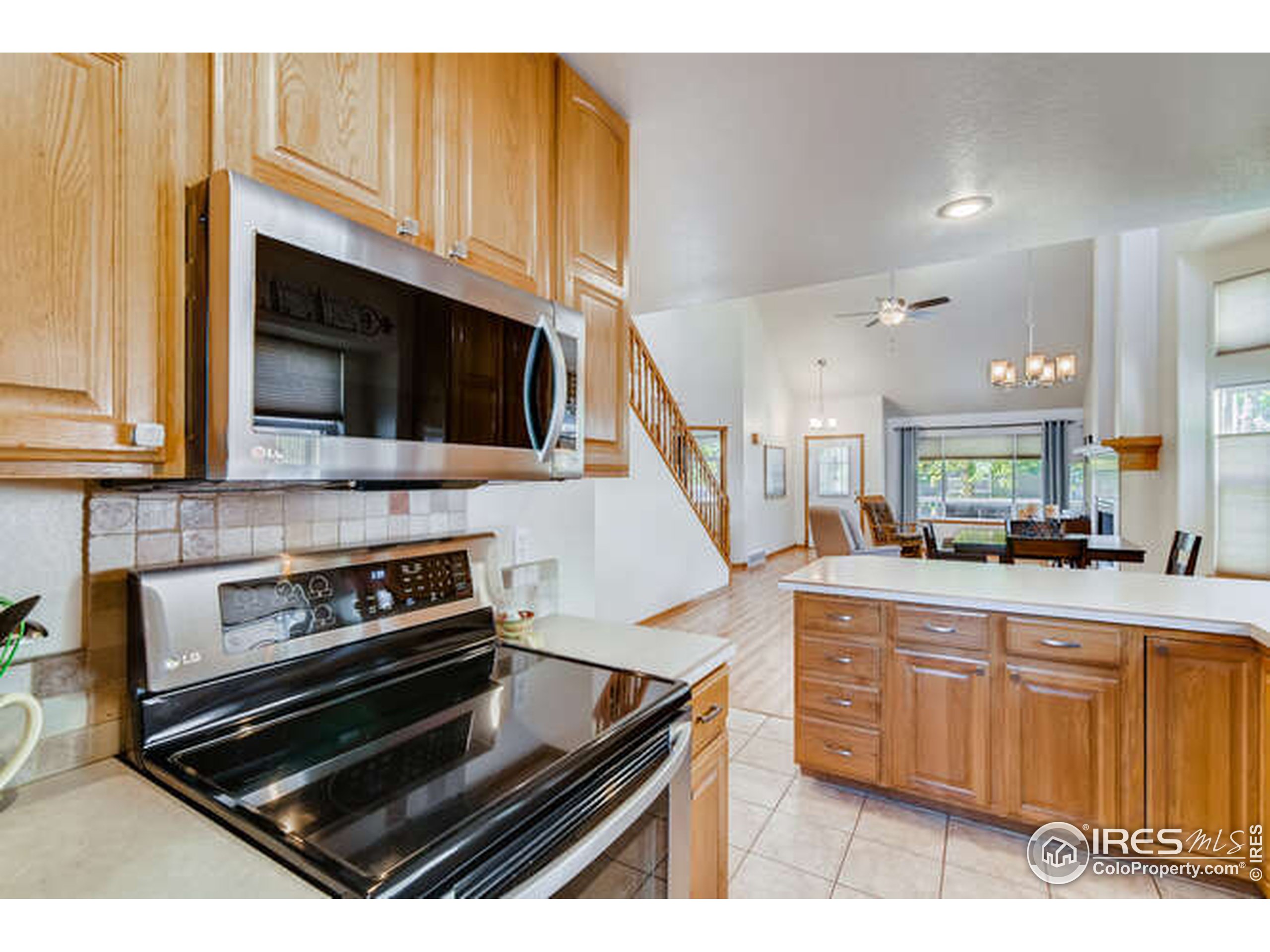 206 Victoria Street Berthoud, CO 80513 - Photo 11 of 29 a kitchen with a stove and a microwave
